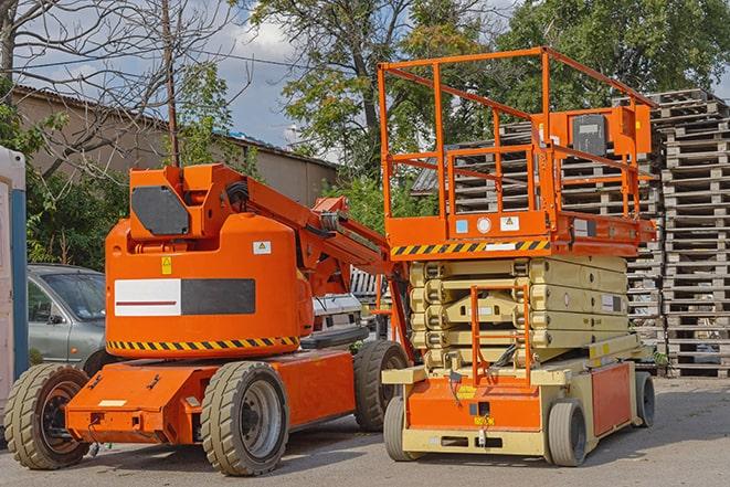 forklift carrying pallets in warehouse in Leshara